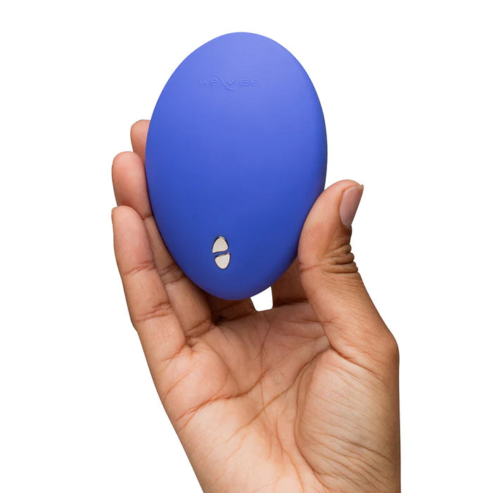 We-Vibe Temp Lavender Blue temperature control vibrator displayed with its USB charging cable, emphasizing easy recharging capabilities.