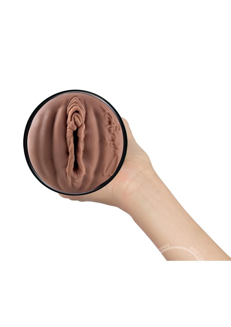 Kiiroo Feel September Reign Black Stroker Interactive Masturbator - Pussy - Black/Chocolate showcasing its realistic design and premium materials for an authentic intimacy experience.