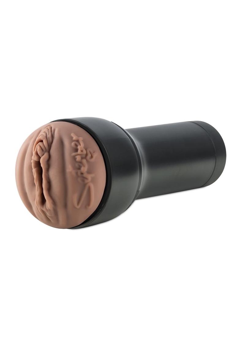 Person holding Kiiroo Feel September Reign Black Stroker Interactive Masturbator - Pussy - Black/Chocolate demonstrating its compact size and ergonomic design for comfortable use.