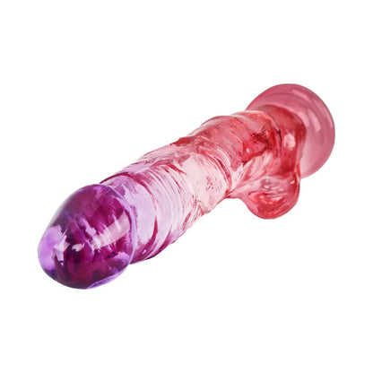 Adam &amp; Eve Sunrise Dreams Realistic Dildo displayed on a smooth surface; sturdy suction cup base makes this realistic dildo ideal for adventurous play.