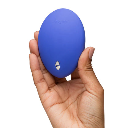 We-Vibe Temp Lavender Blue temperature control vibrator displayed with its USB charging cable, emphasizing easy recharging capabilities.