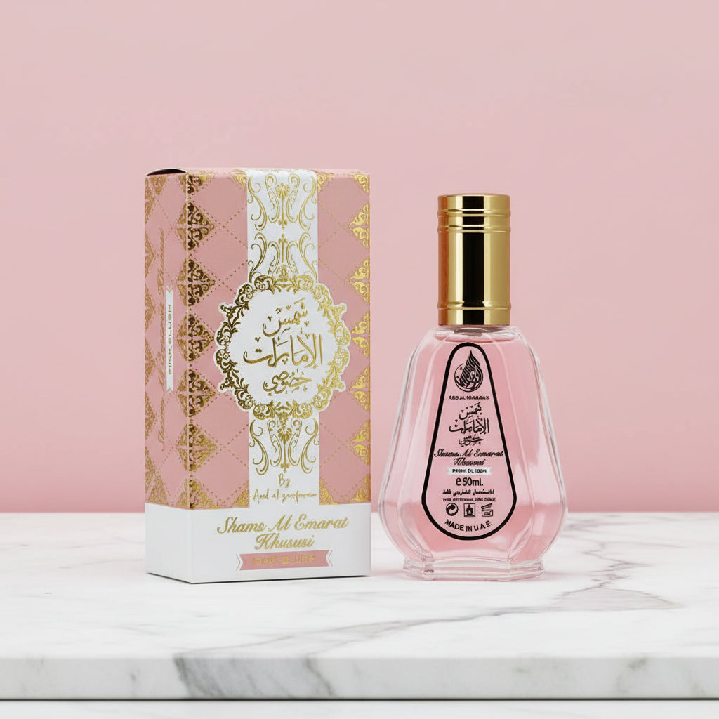 Yara Eau de Parfum pink perfume bottle with matching pink box on marble surface
